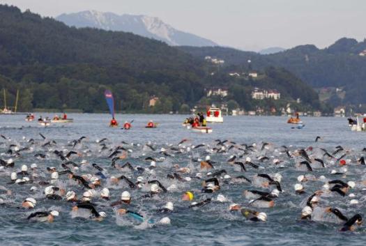 1413649519-competitors-swim-during-ironman-austria-triathlon-race-klagenfurt